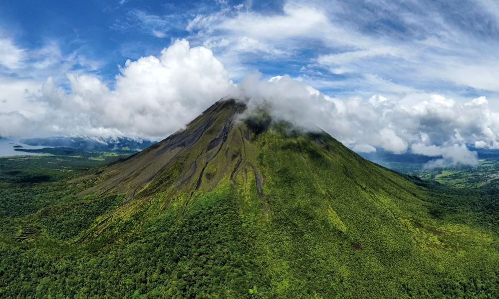 Panoramic view of Arenal volcano with lake