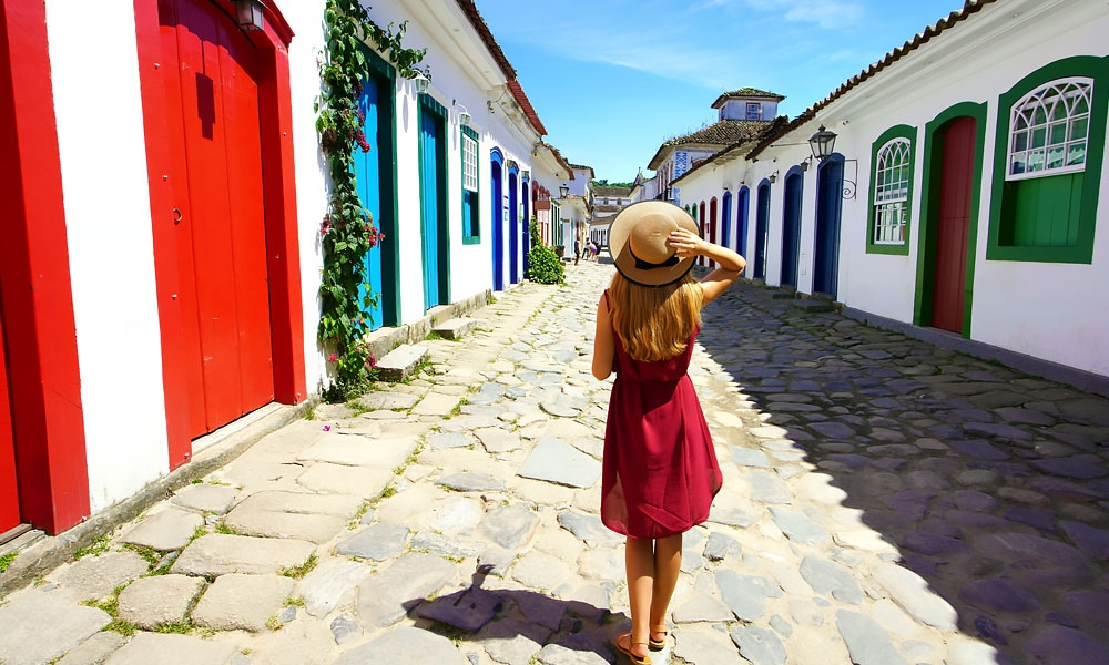 Paraty - A woman walking in the colonial streets