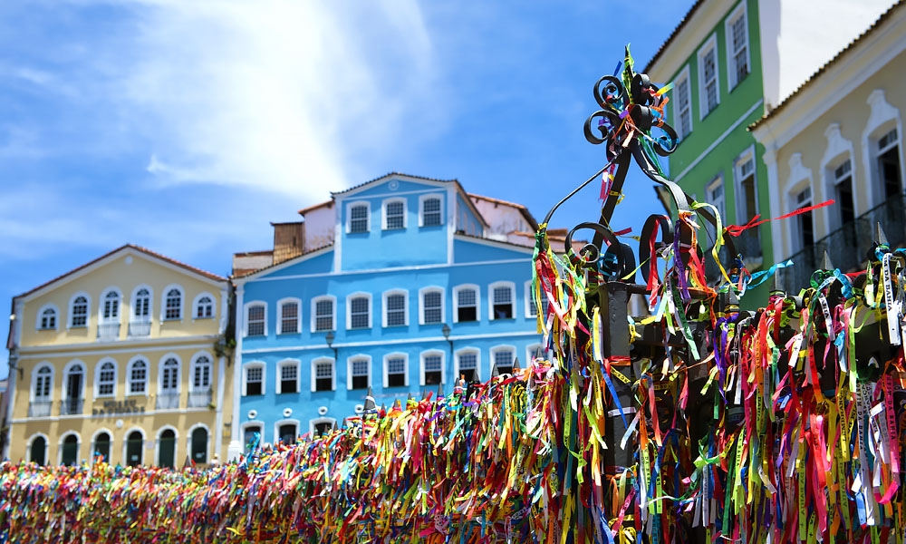 Salvador Bahia Decorative wish ribbons tied to a church gate frame